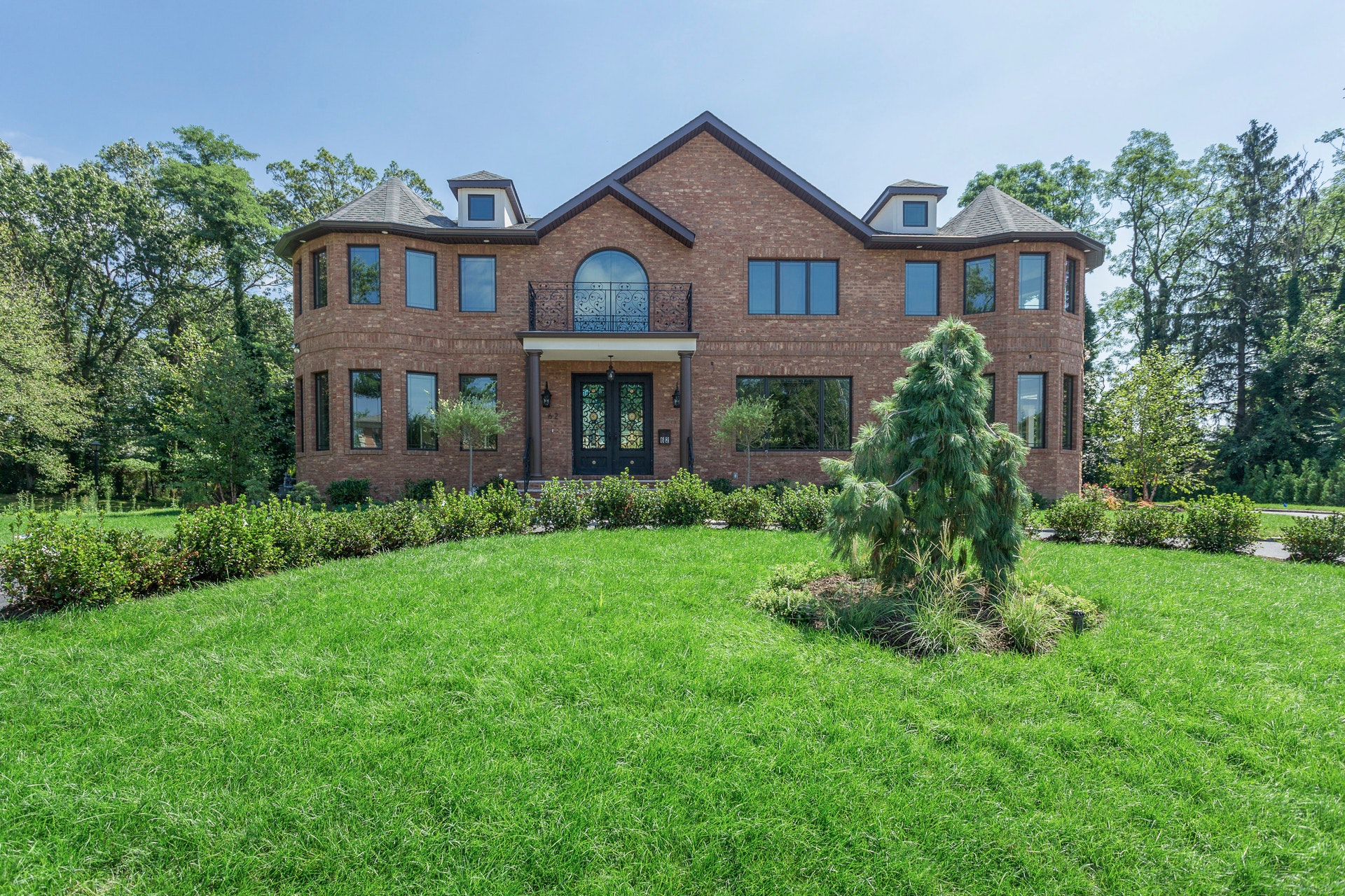 Brand New Brick Colonial Overlooking the rolling fairways of Wheatley Hills golf course