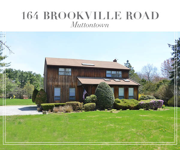 Price Improved!  Peaceful and private Colonial home set on over 2 lush acres in Muttontown